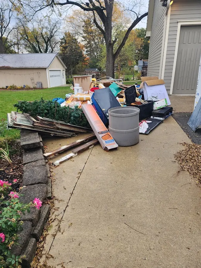 Dumpster being loaded with debris for 30 Yard Dumpster Rental in Jacksonville